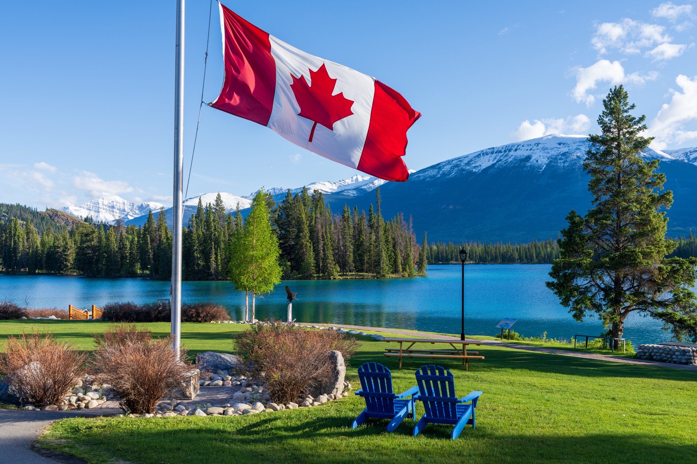 Traveller overlooking a lake in the Canadian Rockies