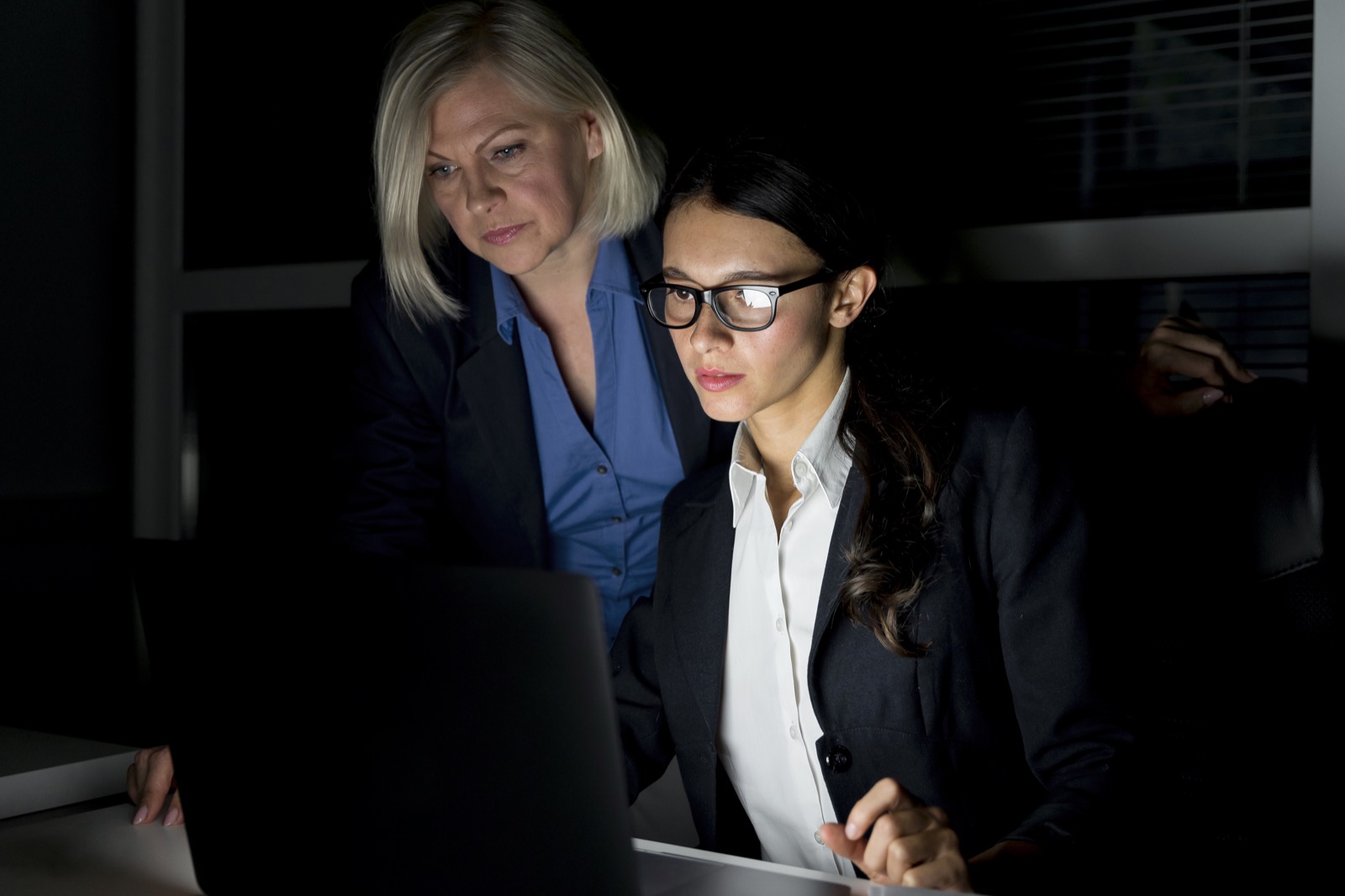 Professionals working on laptops